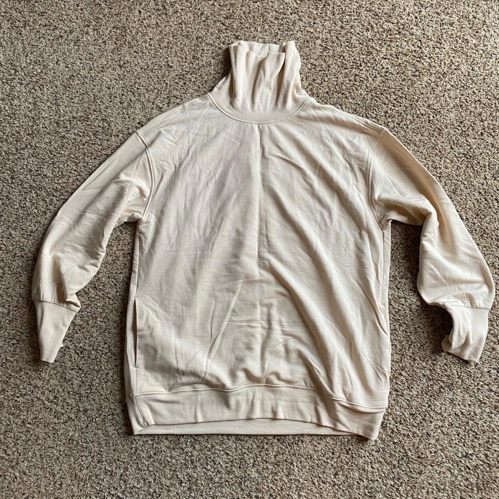 Athleta size medium turtleneck sweatshirt with cute detailing in back